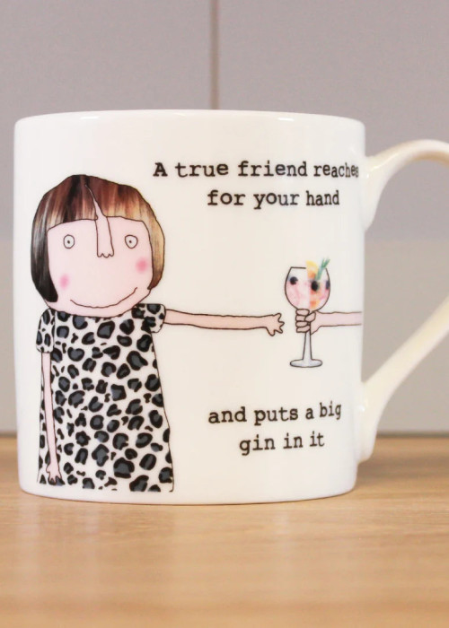 a white mug with a cartoon character holding a glass