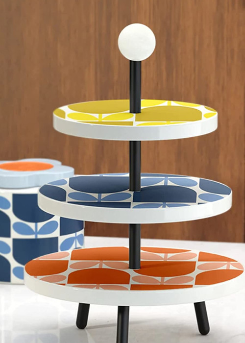 a three tiered tray with colorful designs