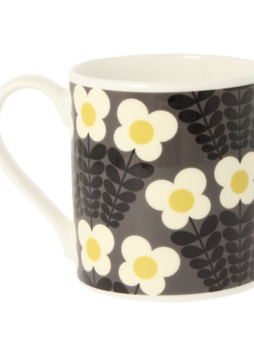 a coffee mug with flowers on it
