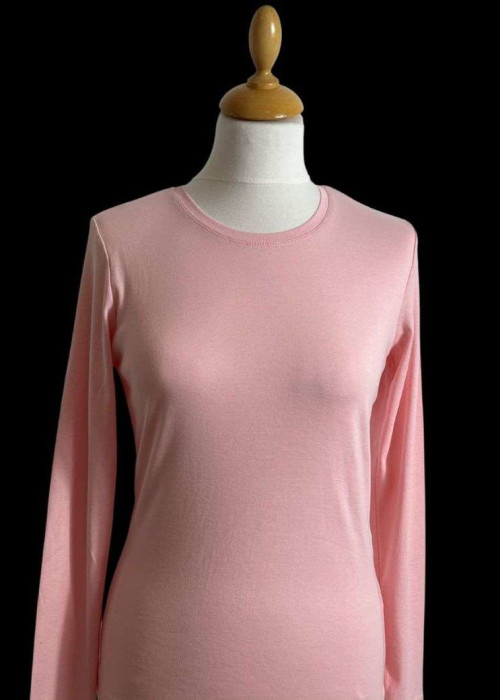 a pink shirt on a mannequin