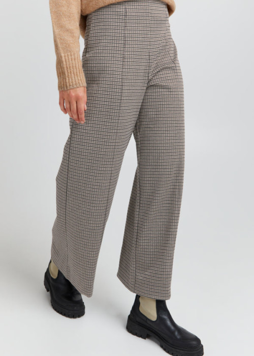 a person wearing a plaid pants