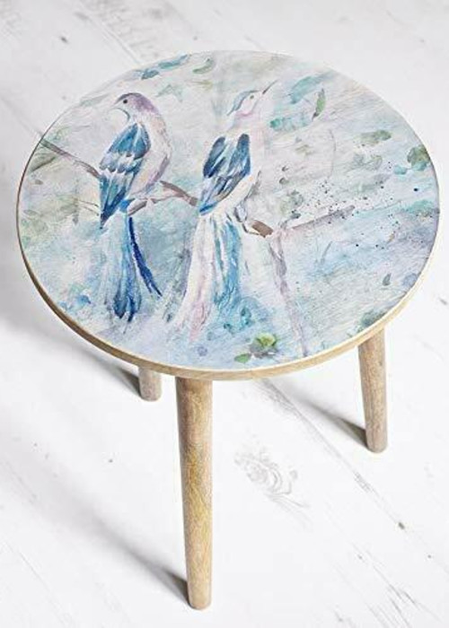 a stool with a painting on it