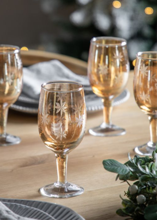 a group of wine glasses on a table