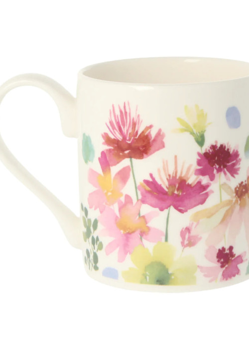 a white mug with a floral design