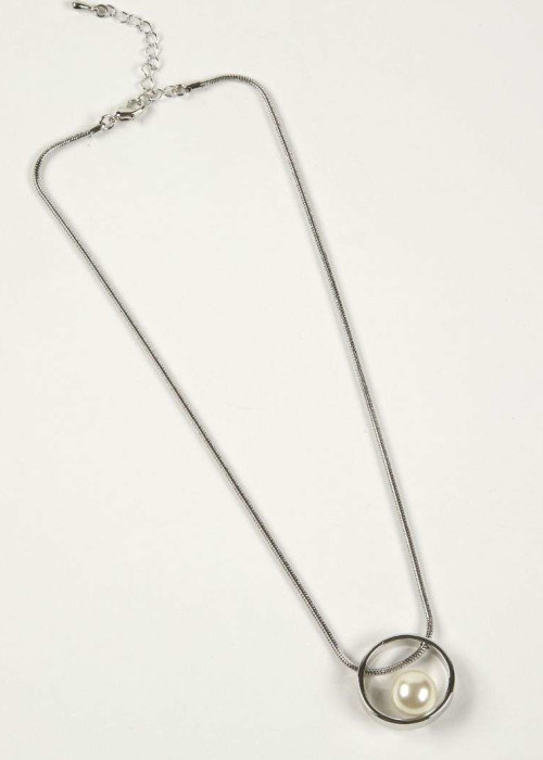 a silver necklace with a circle pendant