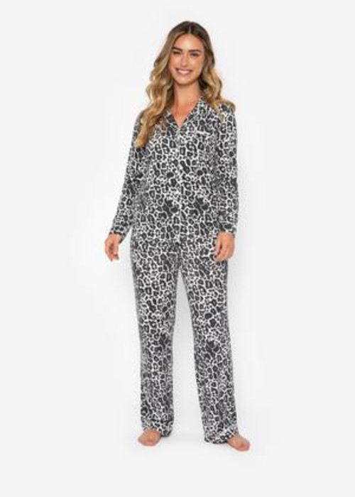 a woman in a leopard print pajamas