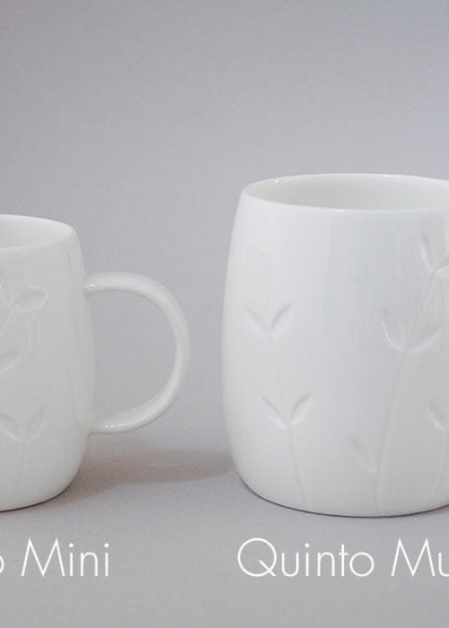 two white mugs with text