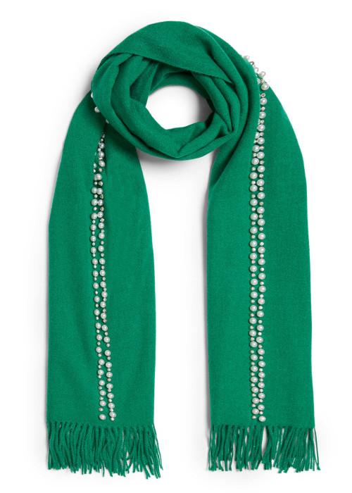 a green scarf with pearls on it