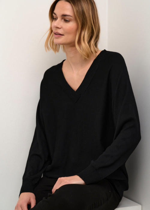 a woman in a black sweater