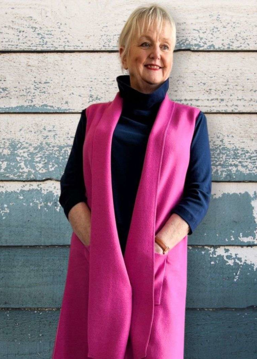 a woman in a pink vest