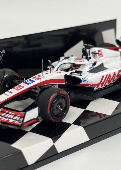 a model race car on a black and white checkered surface