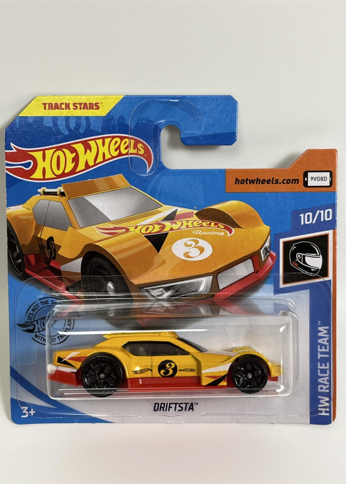 a yellow toy car in a package