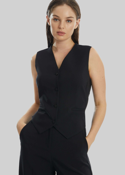 a woman in a black vest