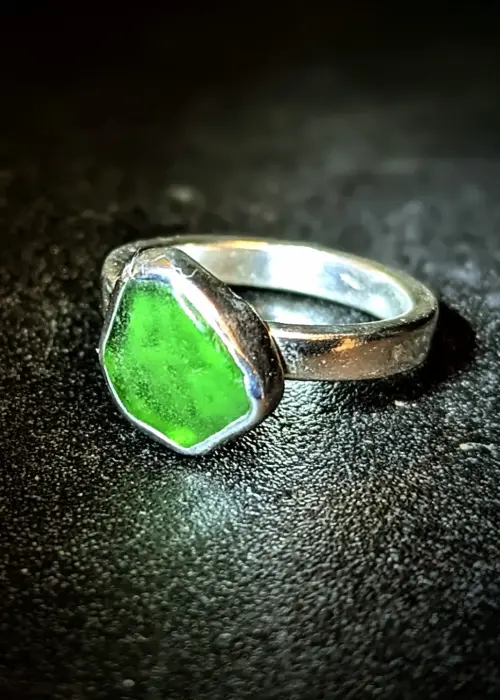 a ring with a green stone