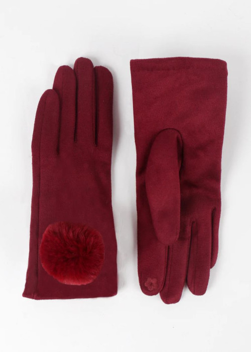 a pair of red gloves with a pompom