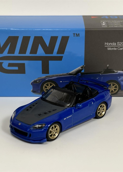 a blue toy car next to a box