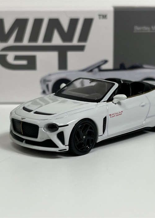 a white toy car with black wheels