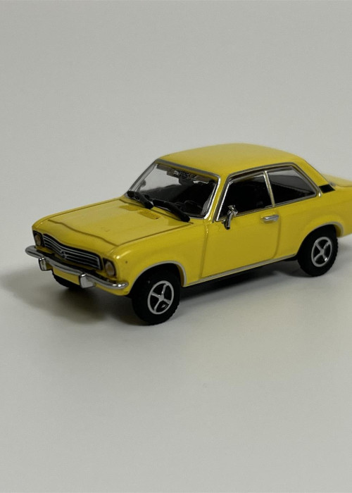 a yellow toy car on a white background