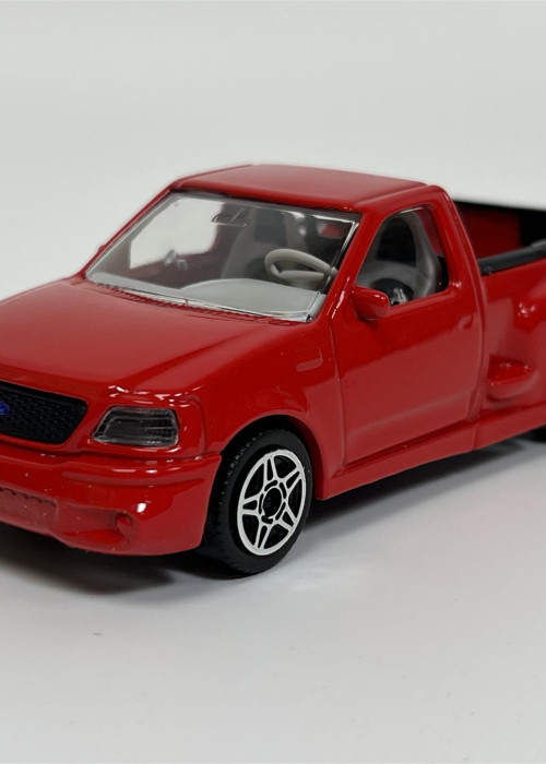 a red toy truck on a white background