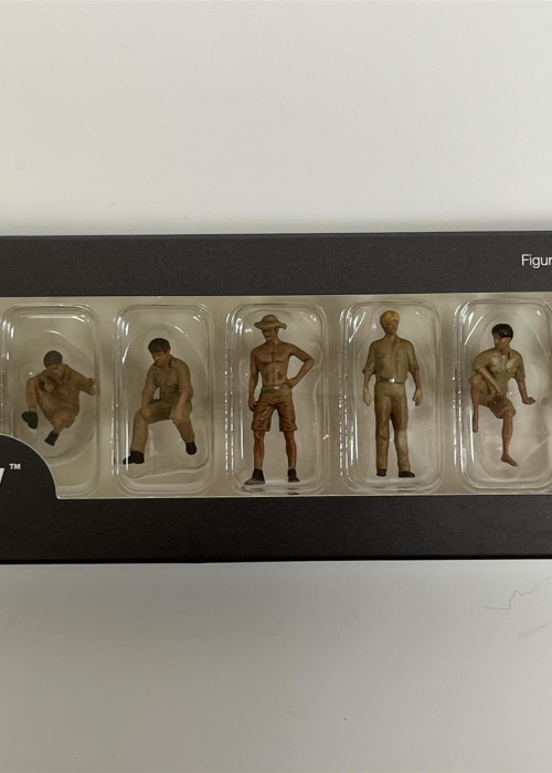 a group of toy figurines in a box