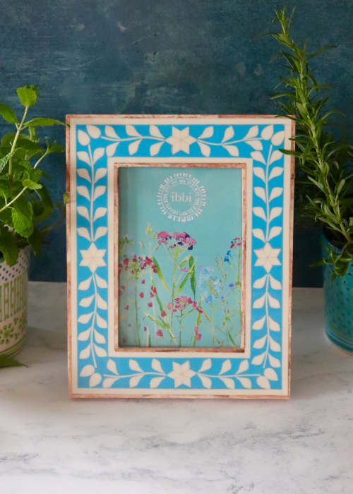 a picture frame with flowers in it