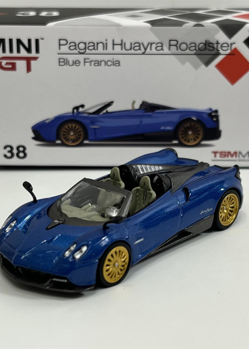 a blue toy car with a box