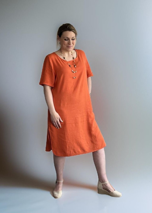 a woman in an orange dress