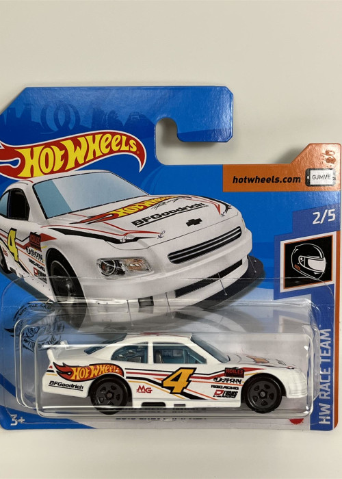 a white toy car in a package