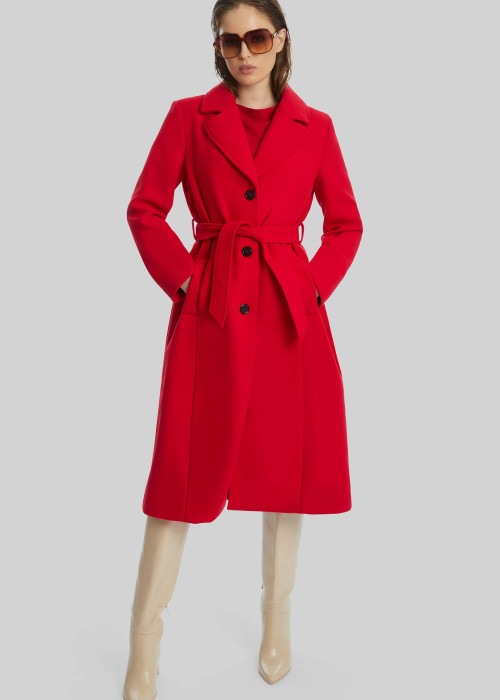 a woman in a red coat