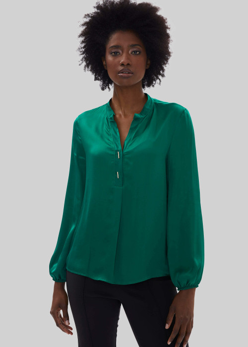 a woman in a green blouse