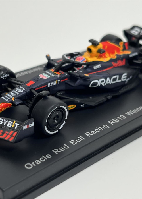 a toy race car on a black stand