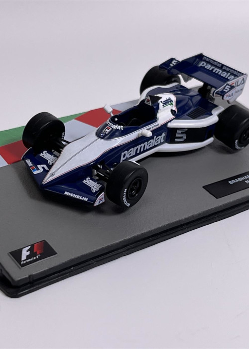 a toy race car on a grey surface