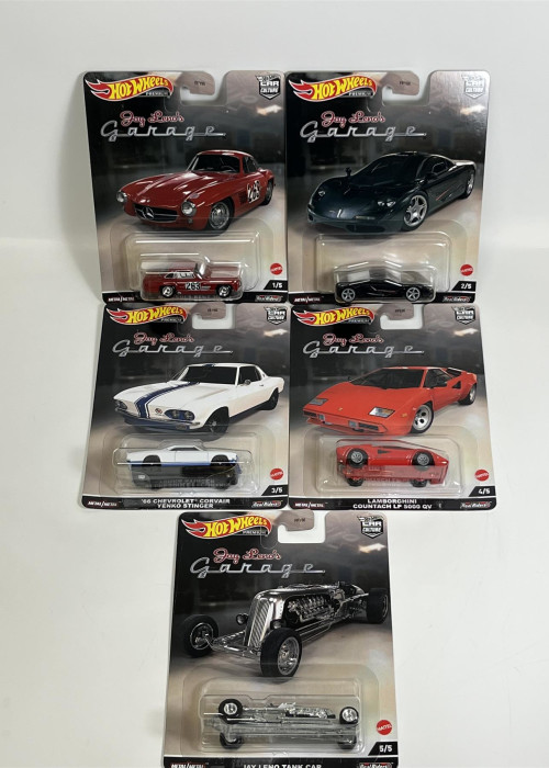 a group of hot wheels cars in packaging
