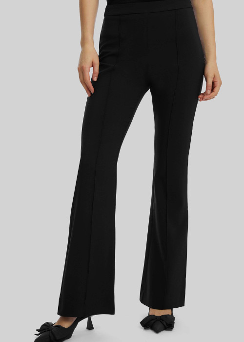 a woman wearing black pants