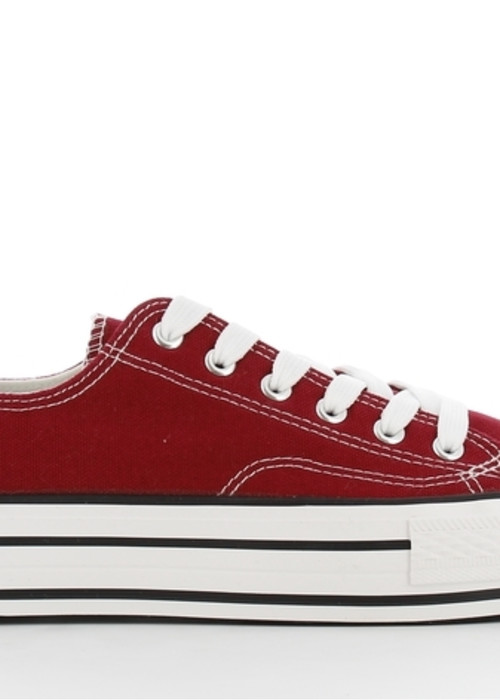 a red and white sneaker