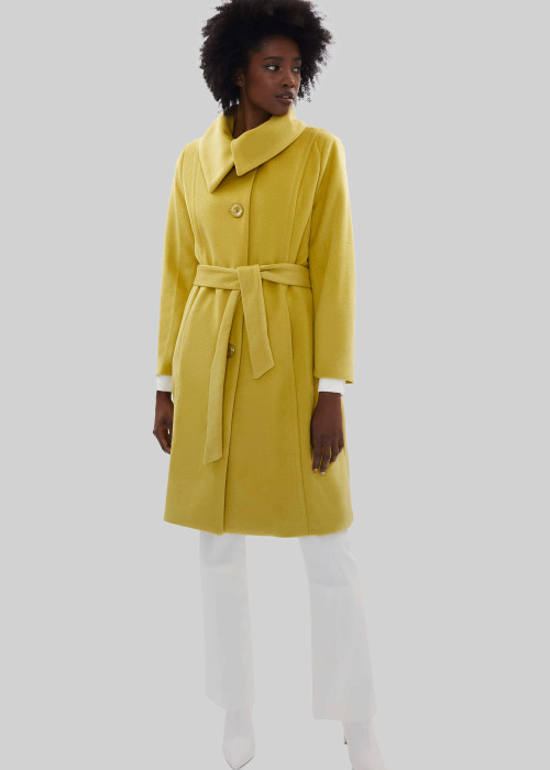a woman in a yellow coat