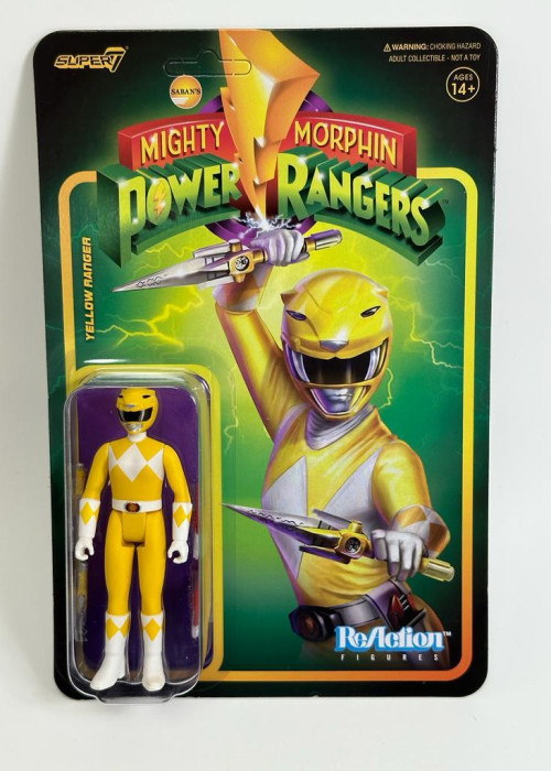 a yellow action figure in a package