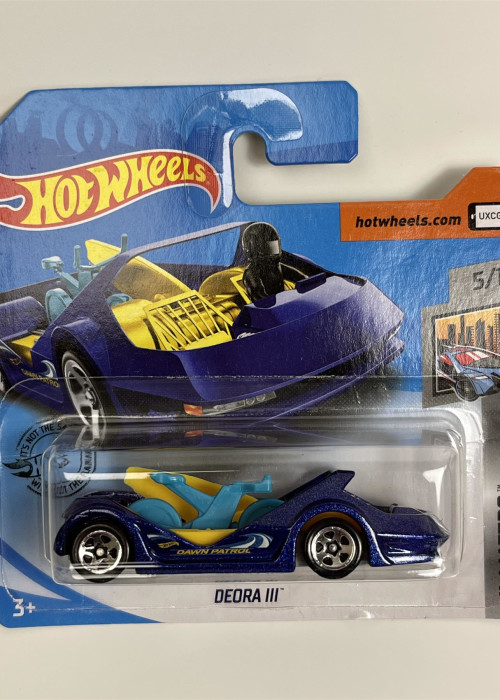 a blue toy car in a package