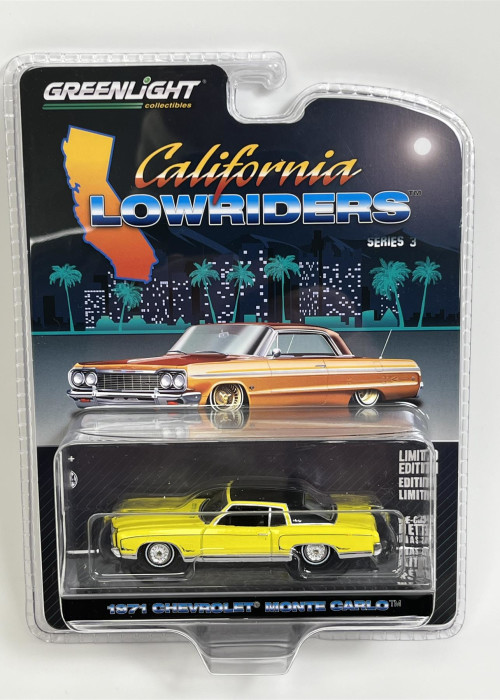 a yellow and orange toy car in a package