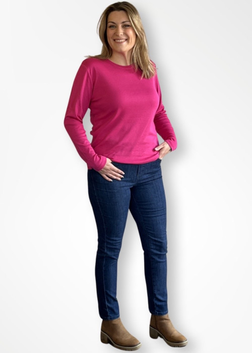 a woman in pink shirt and jeans