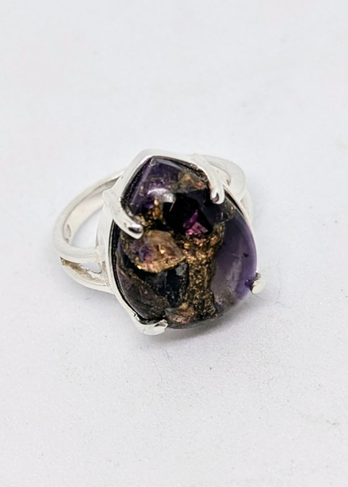 a ring with a purple stone