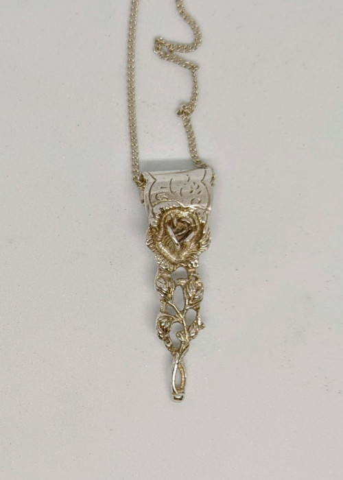 a necklace with a flower on it