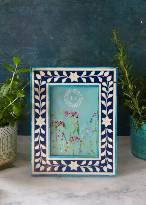 a picture frame with flowers in it