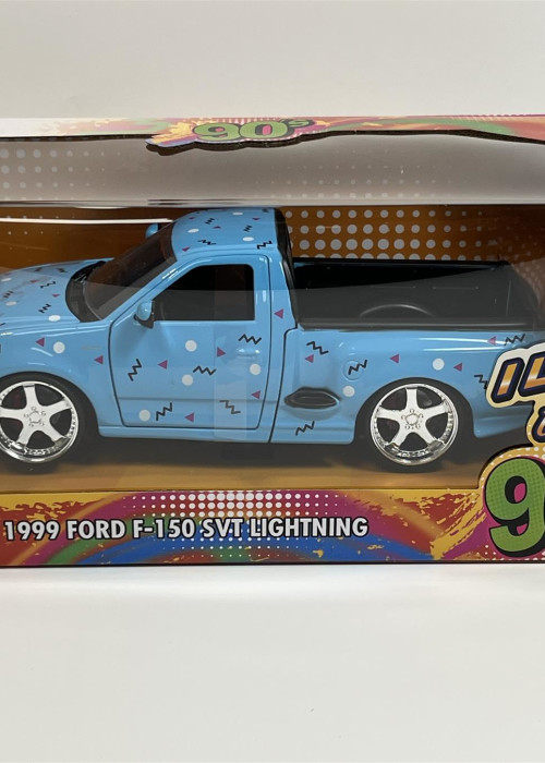 a blue toy truck in a box