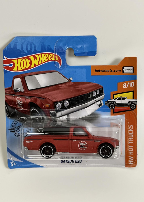 a red toy car in a package