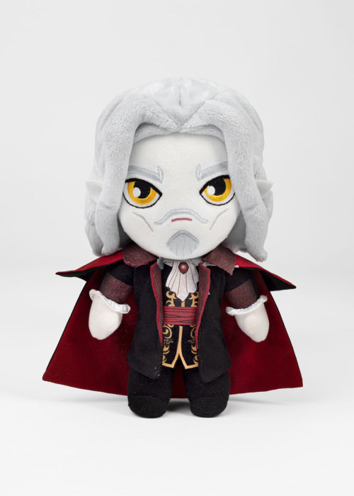 a stuffed toy with a white beard and red cape