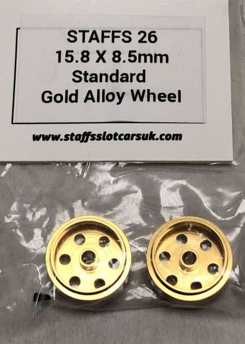 a gold wheel with holes in it