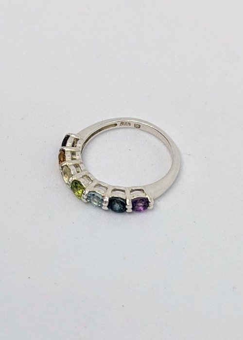 a ring with multicolored gemstones