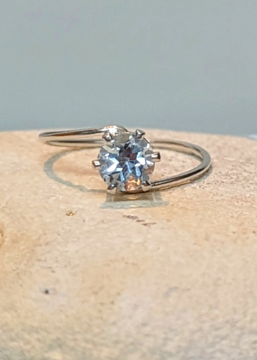 a diamond ring on a rock