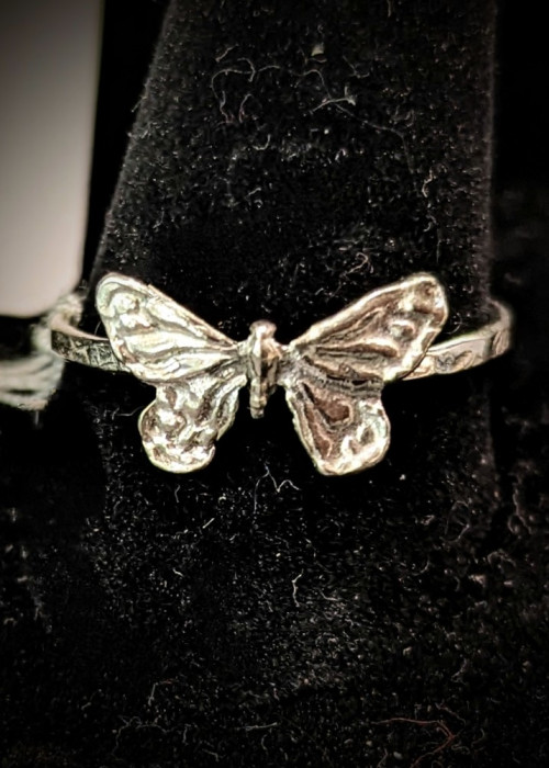 a ring with a butterfly design on it